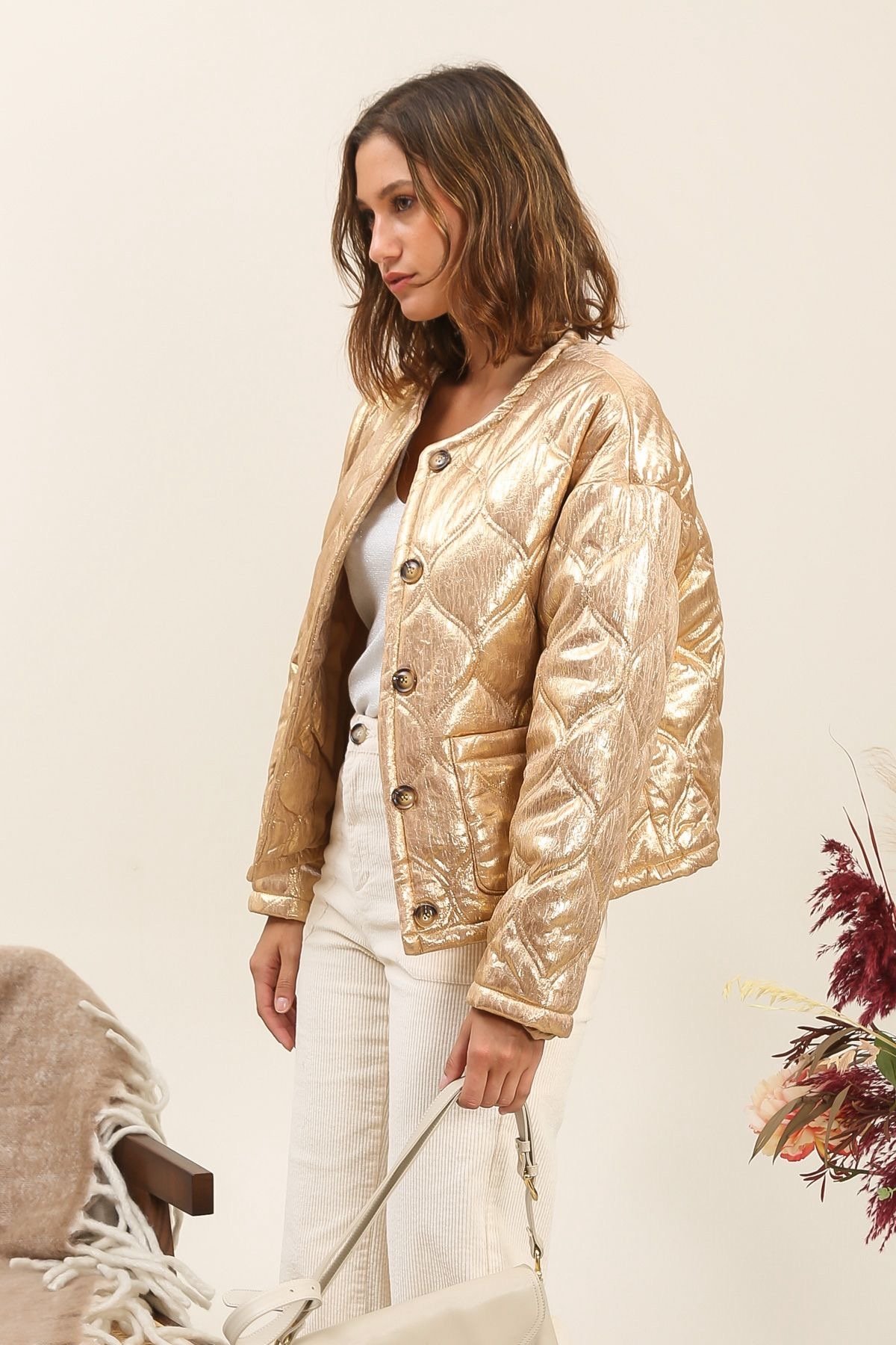 Gewatteerde goudkleurige jasje Inspiration Studio